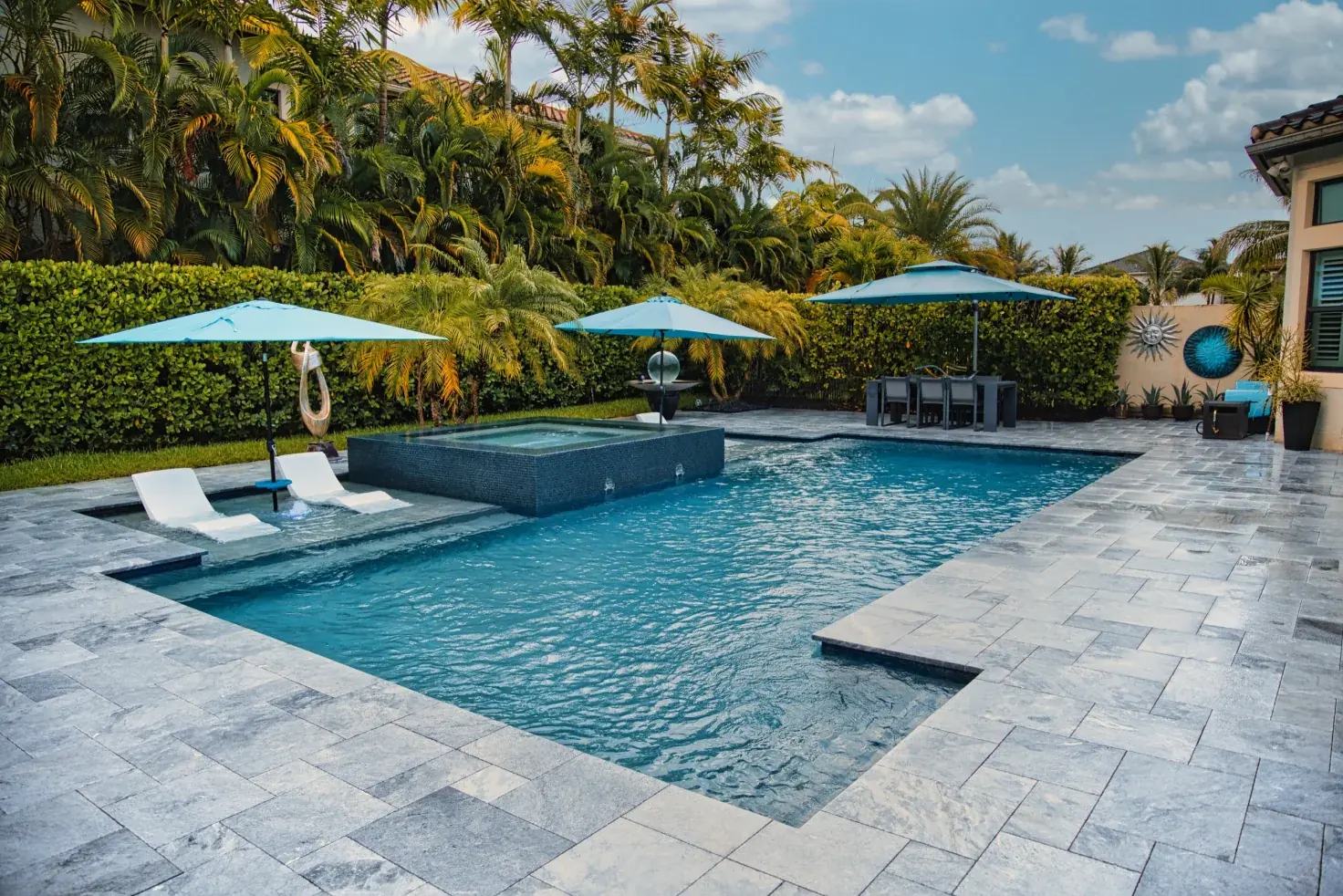 Family gathered around a Brisa pool on a Saturday afternoon